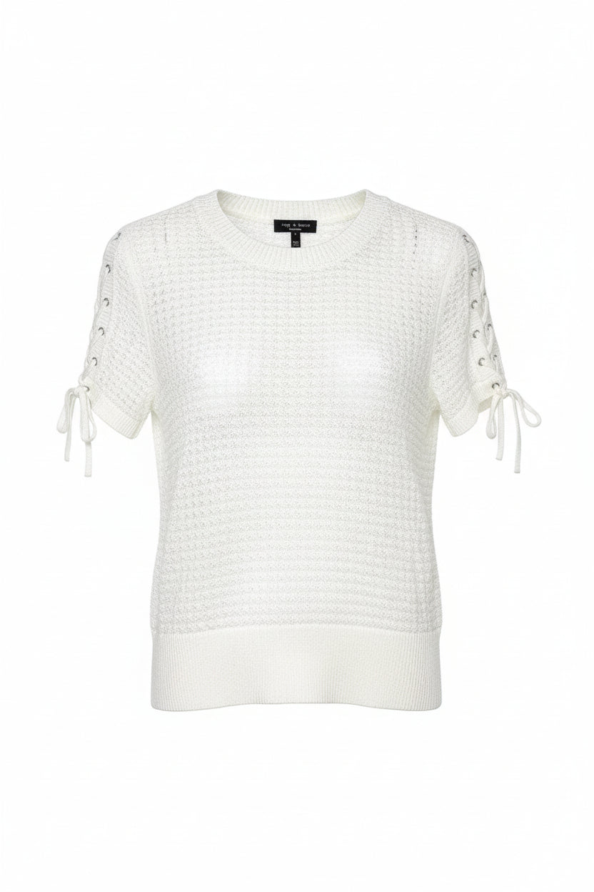 White knit sweater with lace-up sleeves on a hanger against a white background