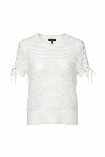 White knit sweater with lace-up sleeves on a hanger against a white background