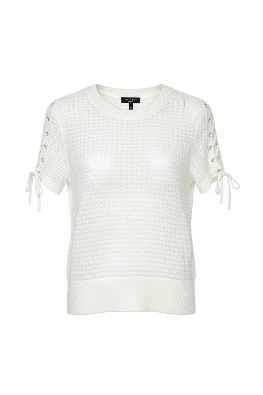 White knit sweater with lace-up sleeves on a hanger against a white background