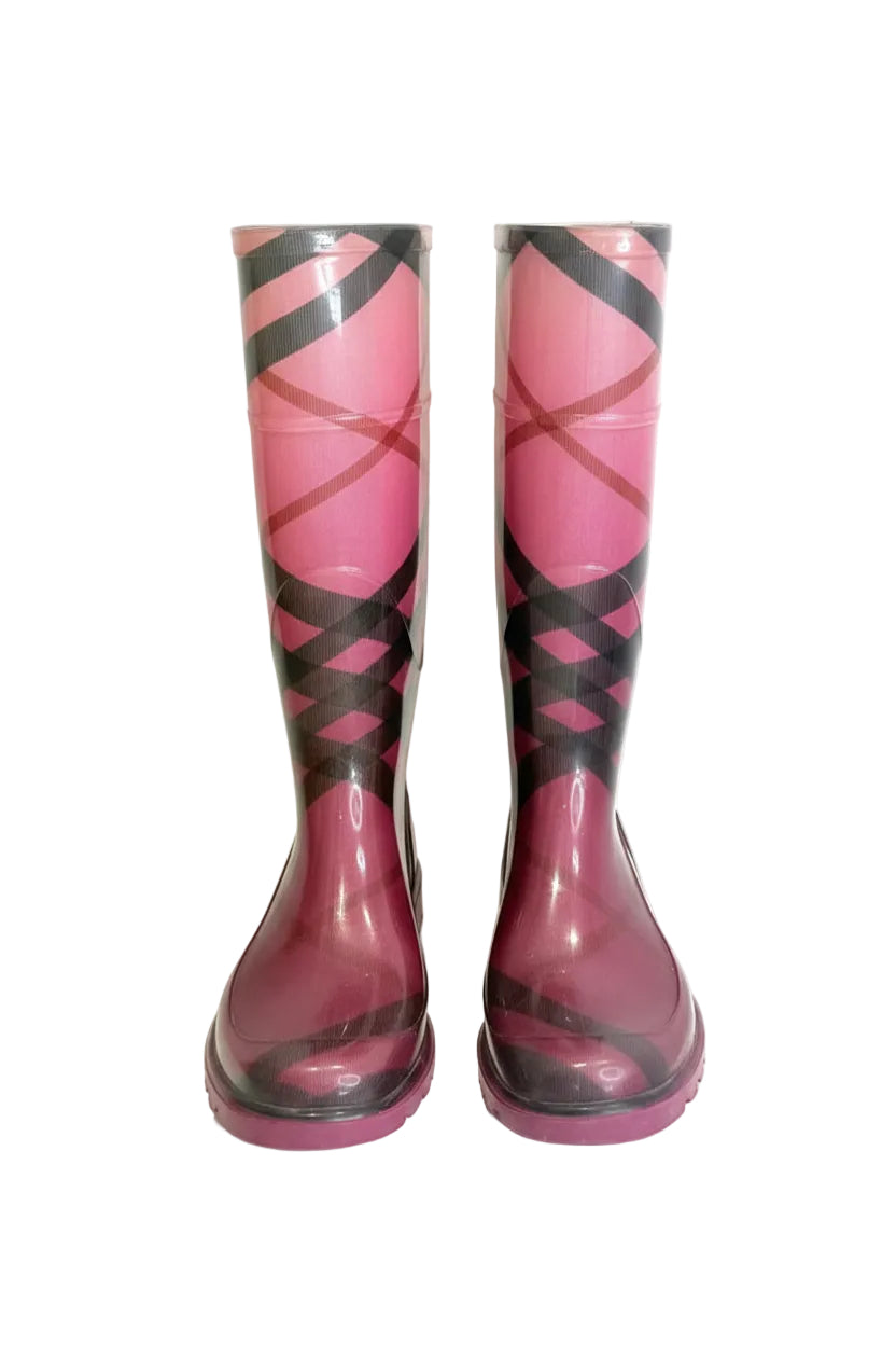 Pair of pink and black patterned rain boots on a white background