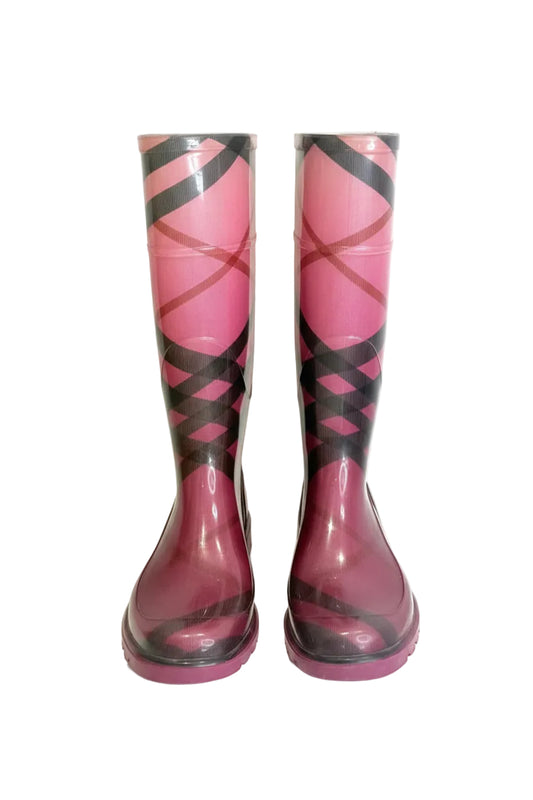 Pair of pink and black patterned rain boots on a white background