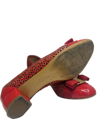 Red shoes with a bow on a white background