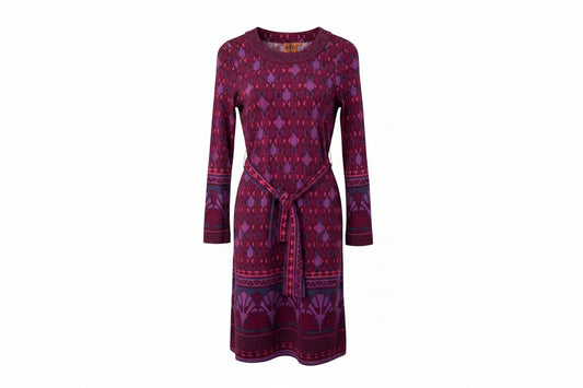 Purple patterned dress on a hanger against a white background